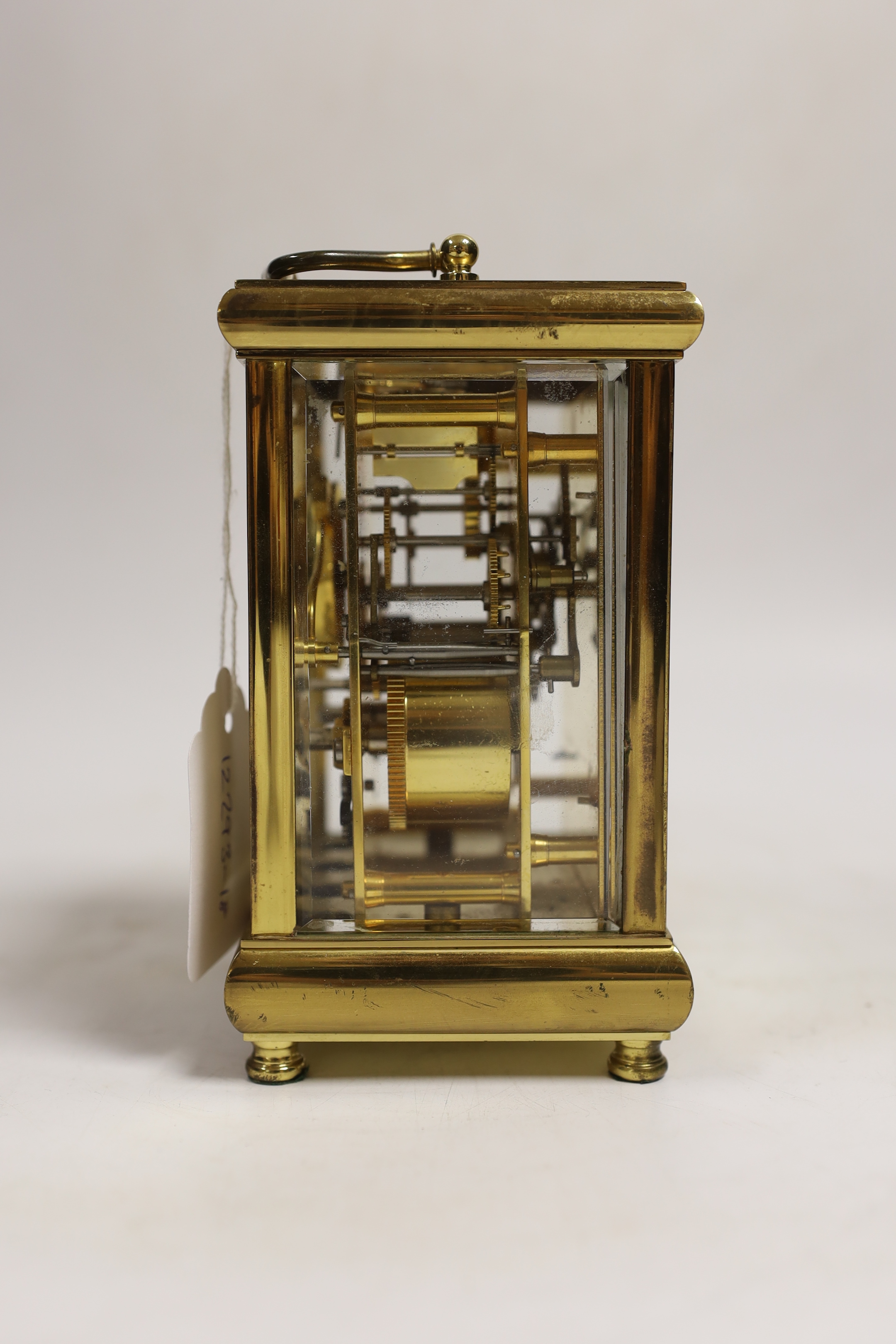 A 20th century brass carriage clock, signed Taylor and Bligh, England, striking on a bell 14cm high